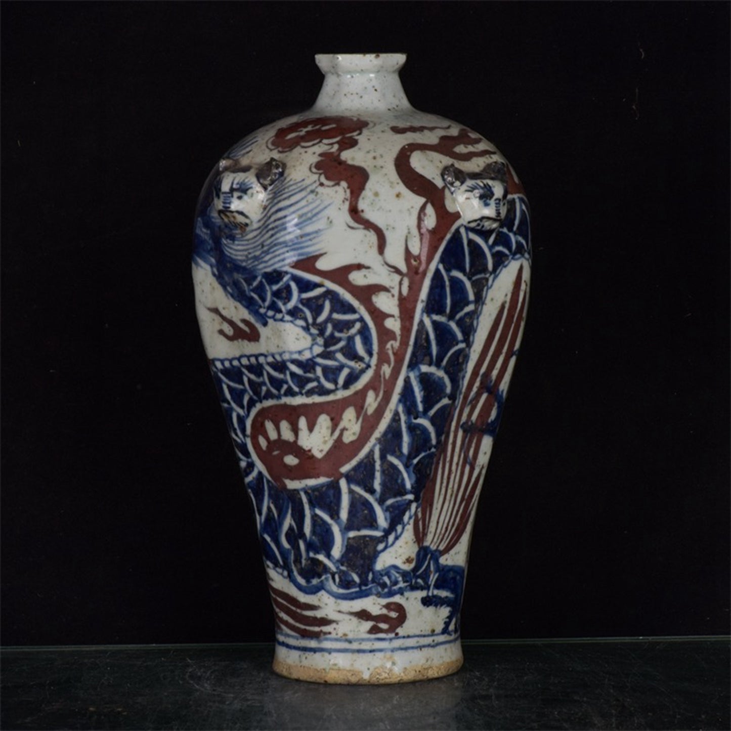 Chinese antique blue and white glazed red dragon patterned silk lion head plum vase