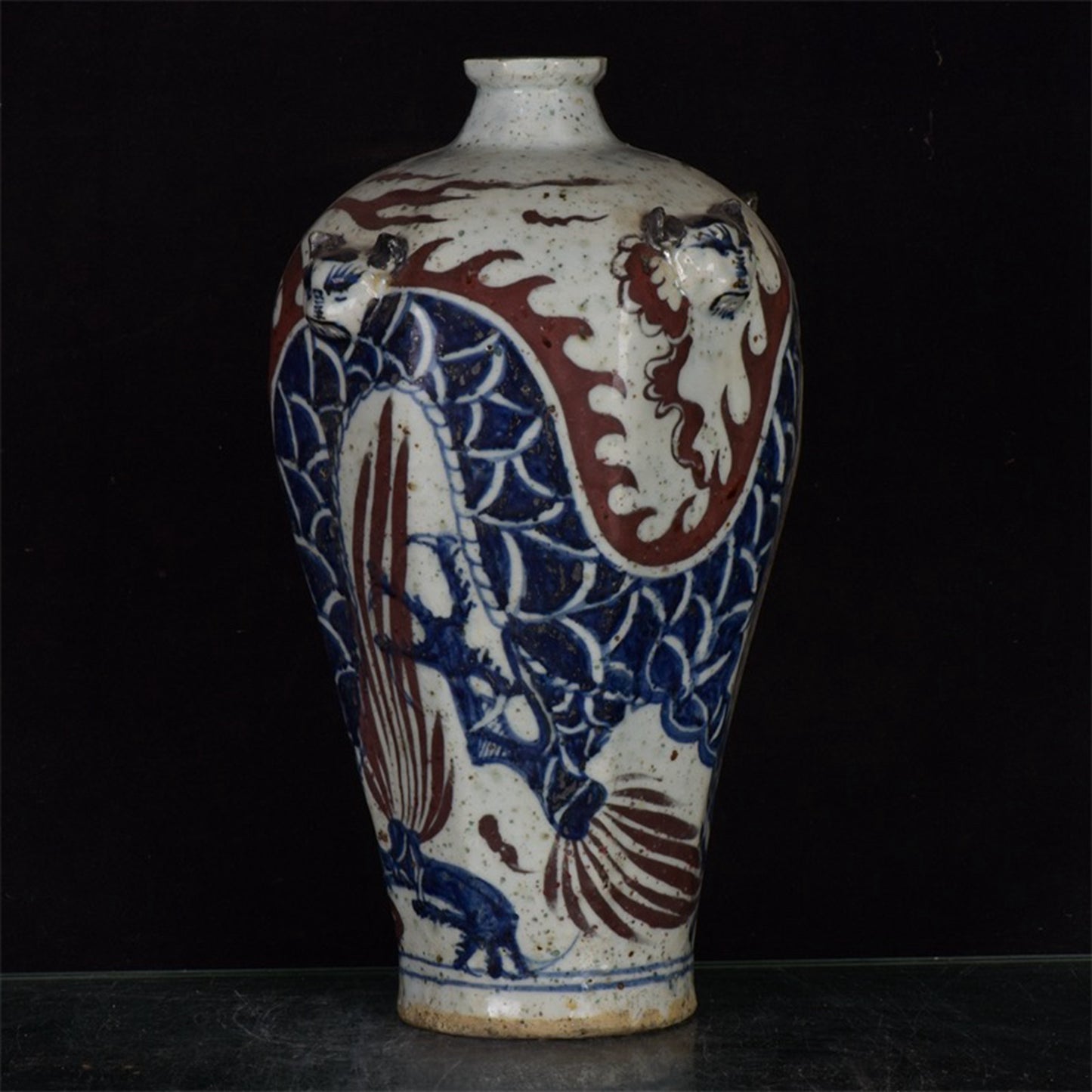 Chinese antique blue and white glazed red dragon patterned silk lion head plum vase
