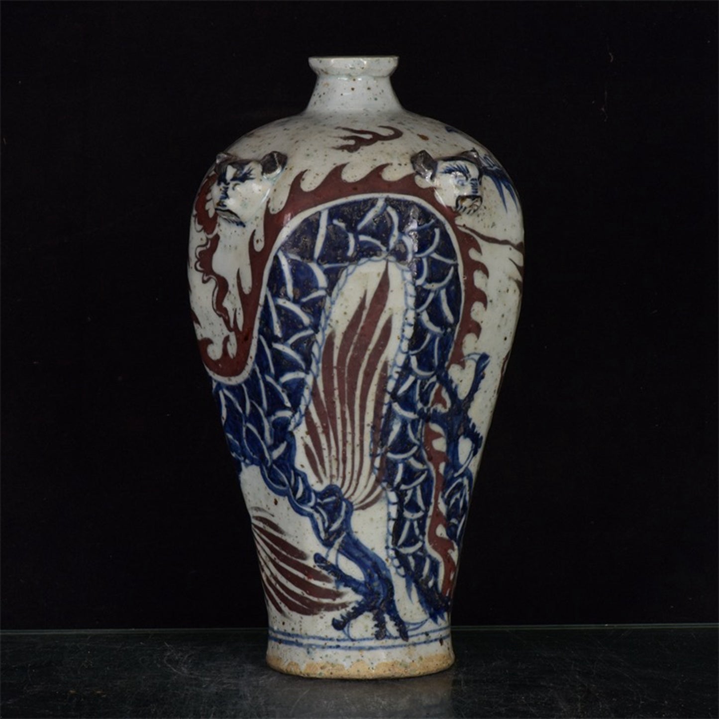 Chinese antique blue and white glazed red dragon patterned silk lion head plum vase