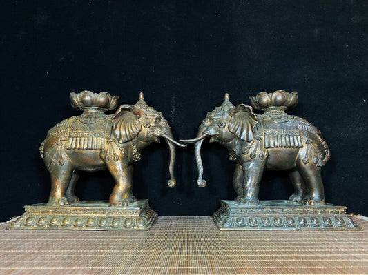 A pair of Chinese antique pure copper elephant lotus wax stands