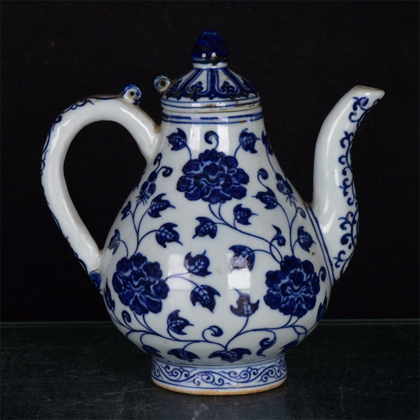 Chinese antique blue and white pear shaped teapot with tangled branches and floral patterns