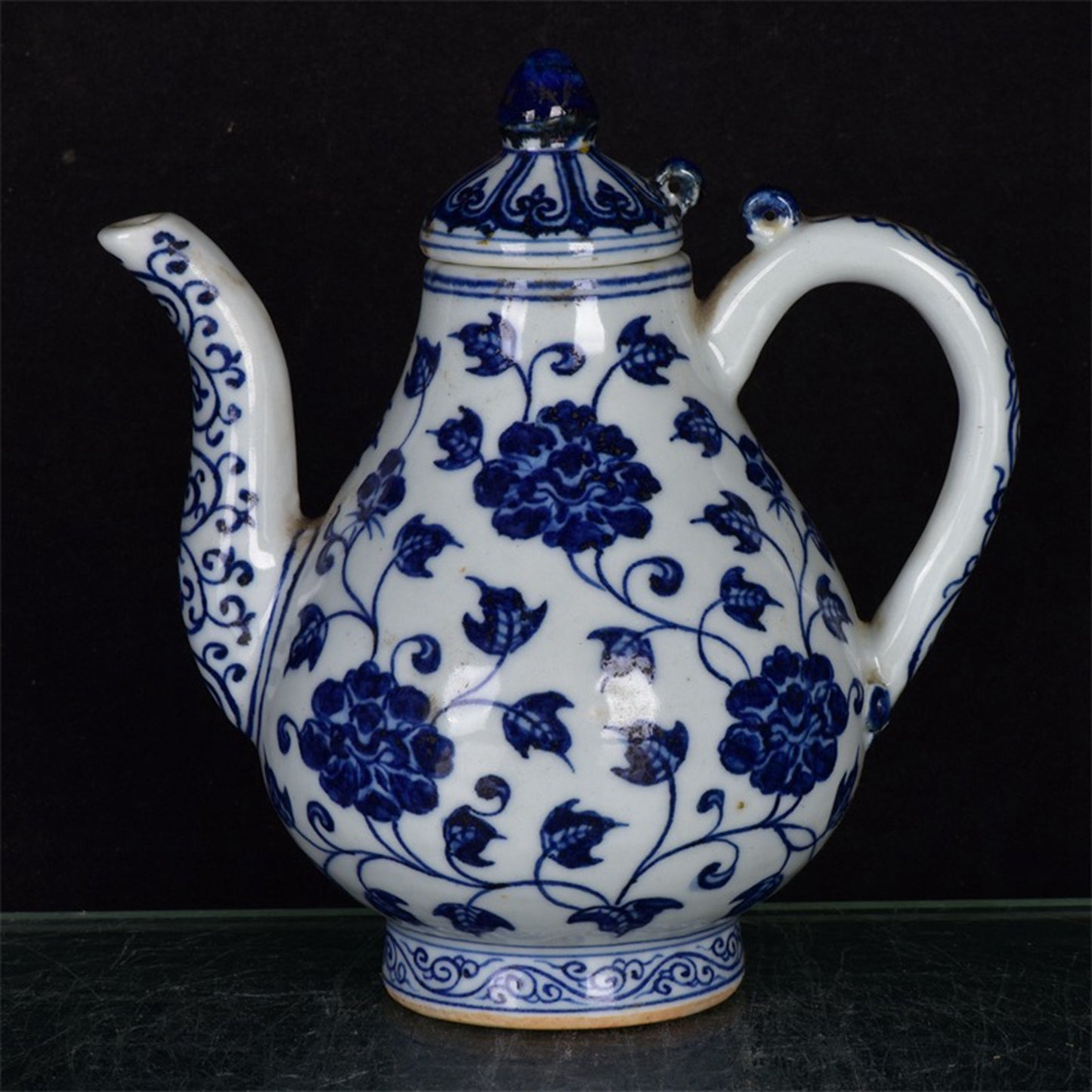 Chinese antique blue and white pear shaped teapot with tangled branches and floral patterns