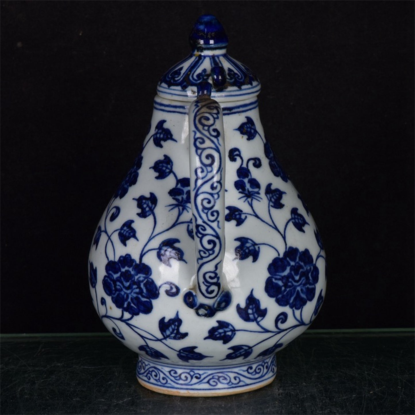 Chinese antique blue and white pear shaped teapot with tangled branches and floral patterns