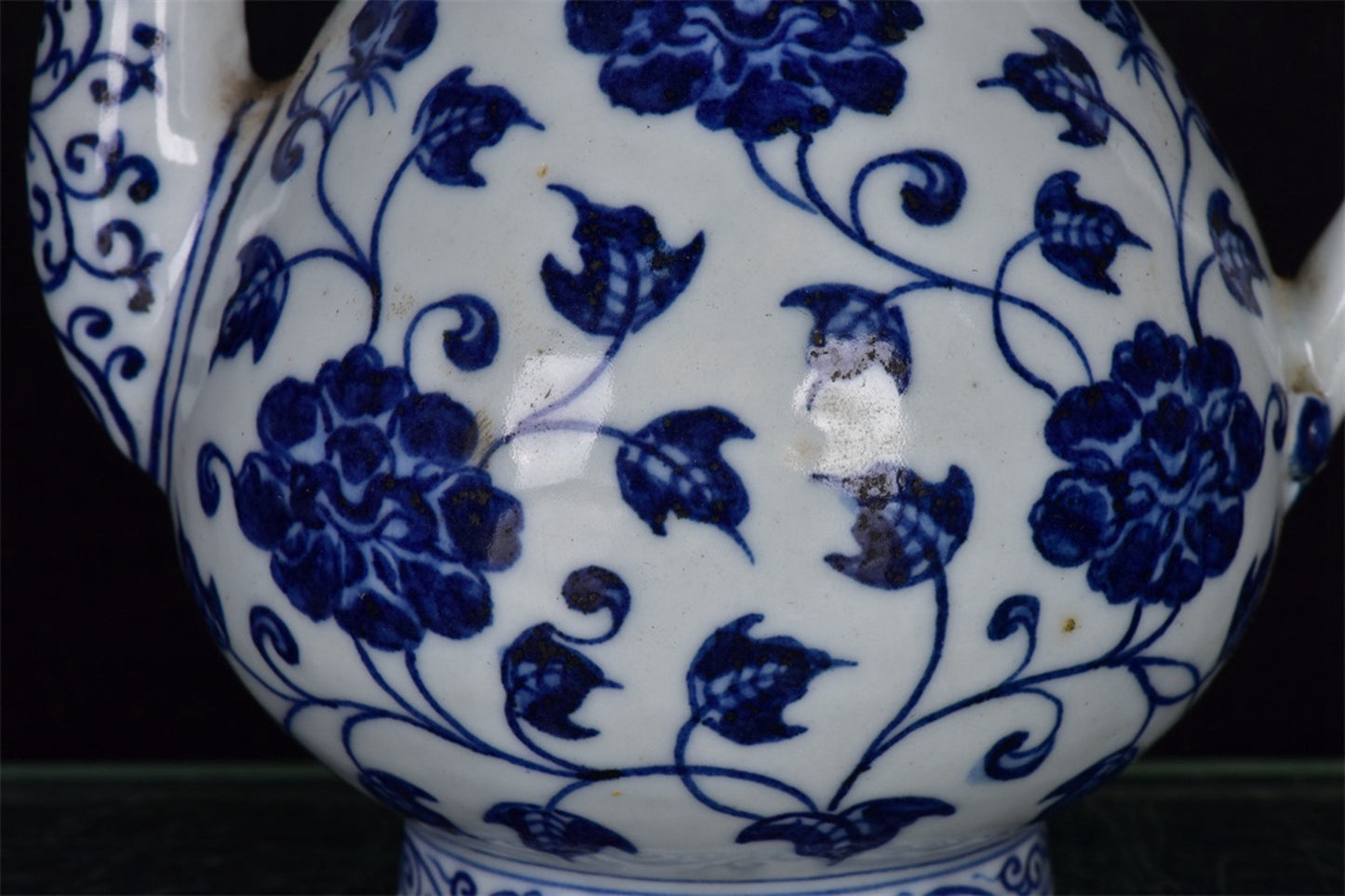 Chinese antique blue and white pear shaped teapot with tangled branches and floral patterns