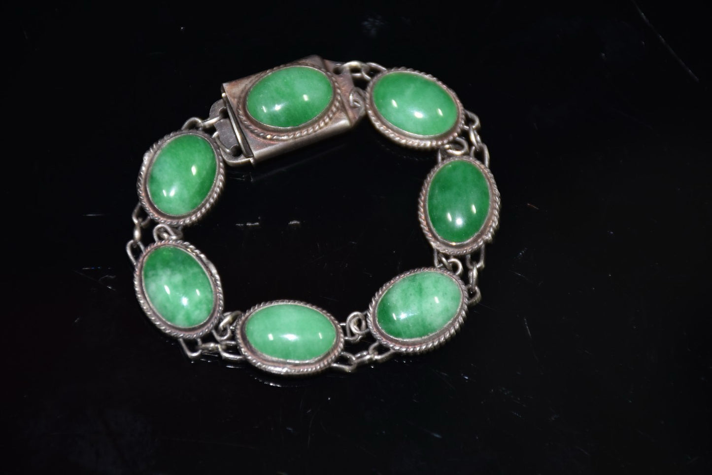 Early collection of sterling silver inlaid emerald gemstone bracelet ornaments