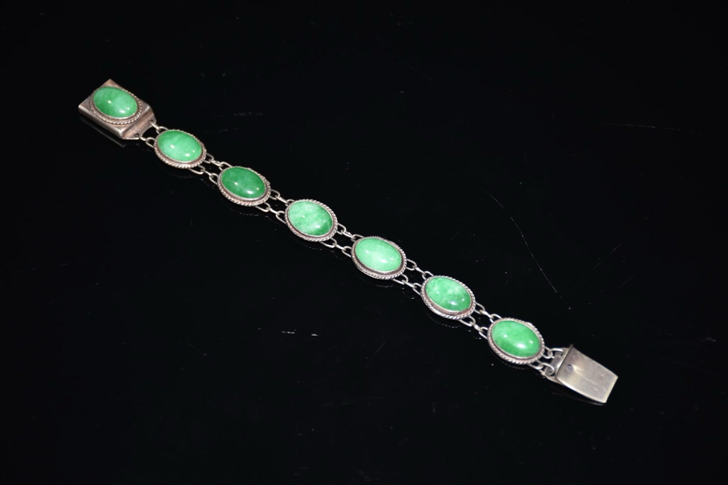 Early collection of sterling silver inlaid emerald gemstone bracelet ornaments