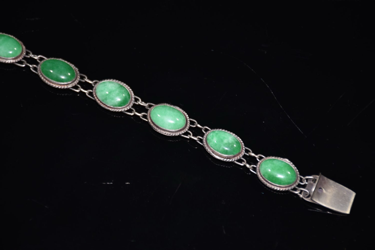 Early collection of sterling silver inlaid emerald gemstone bracelet ornaments
