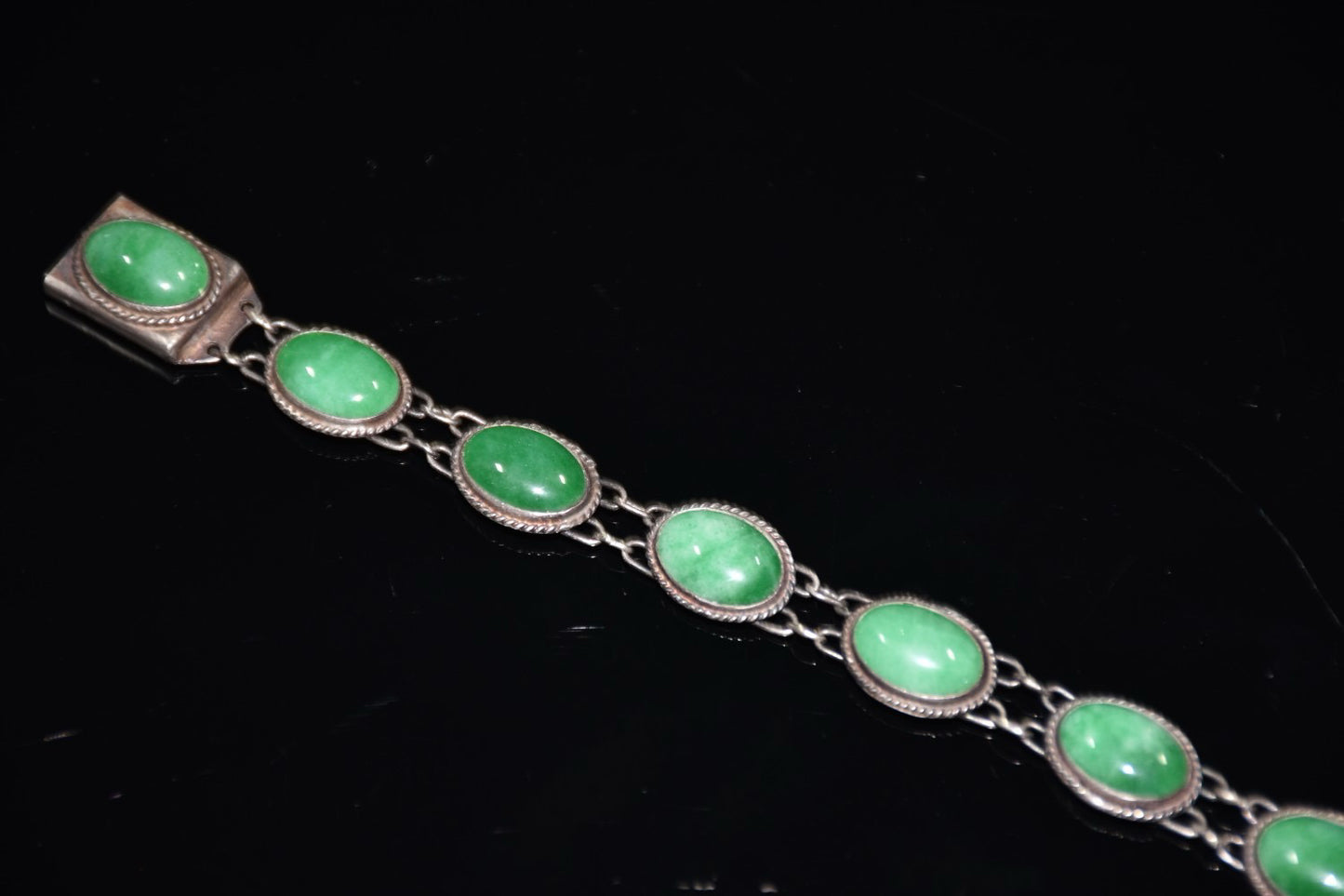 Early collection of sterling silver inlaid emerald gemstone bracelet ornaments