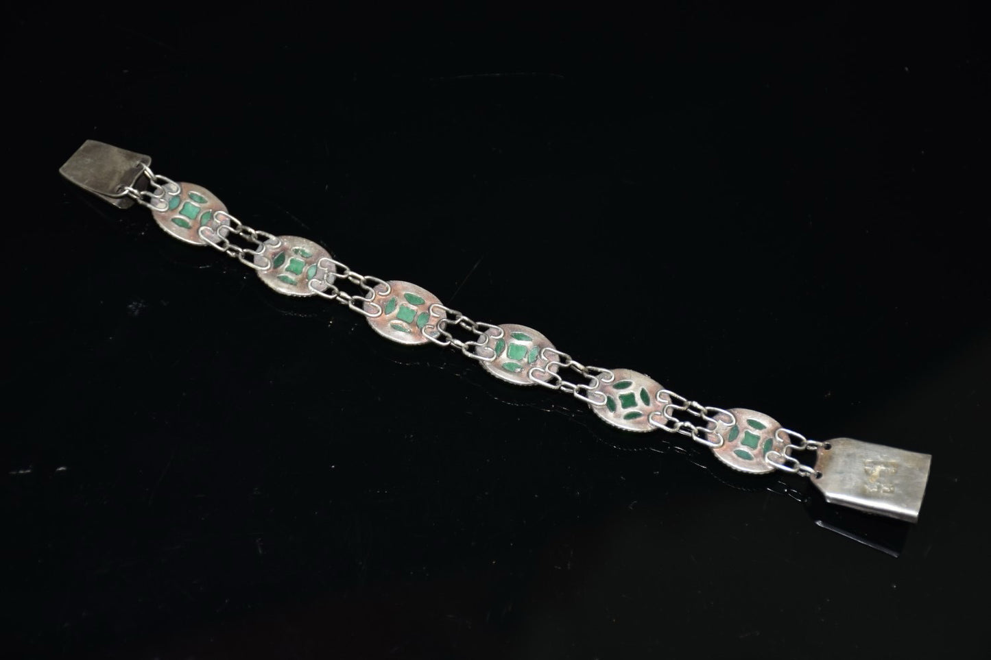 Early collection of sterling silver inlaid emerald gemstone bracelet ornaments