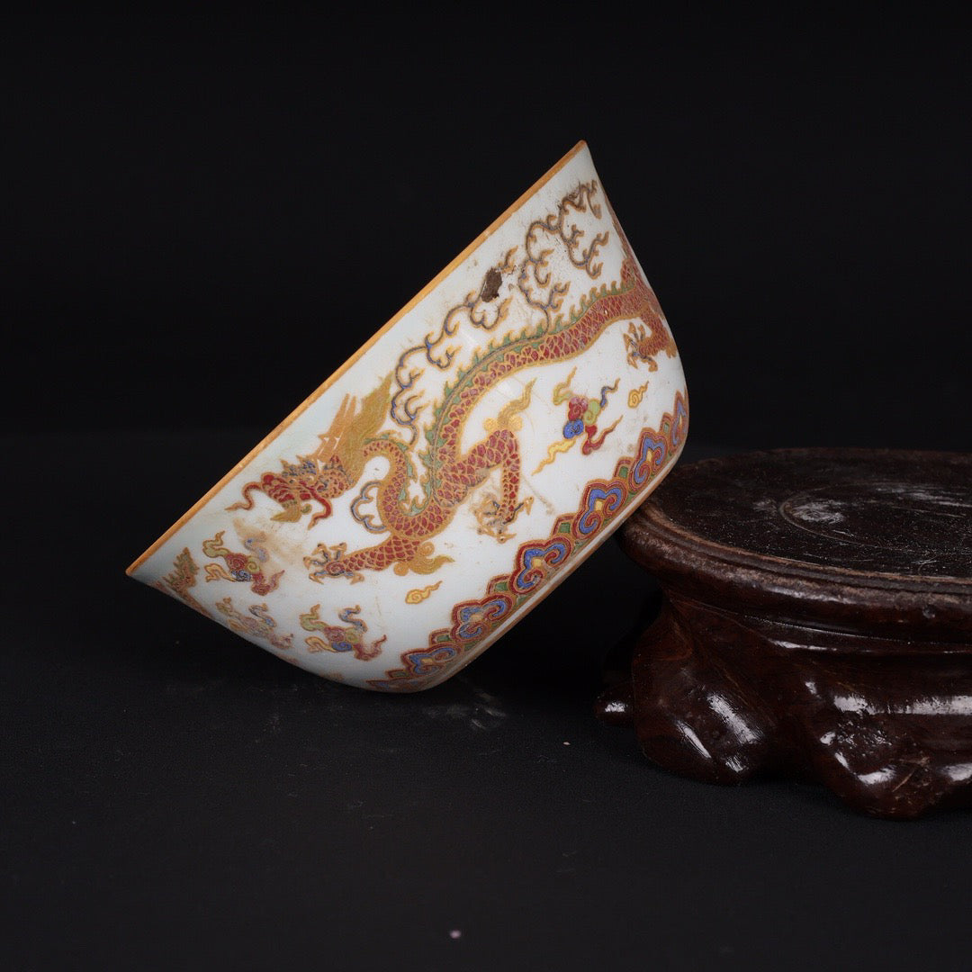 A pair of Chinese antique flat bottomed cups with patterns of double dragons playing with pearls