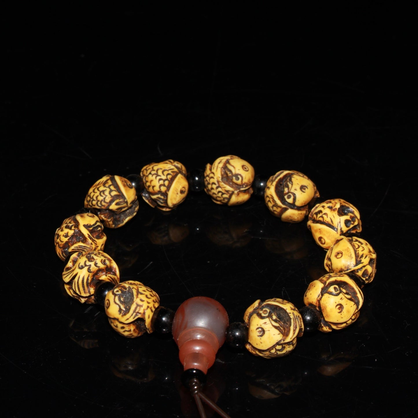 Early collection of ox bone carvings, annual fish bracelet ornaments