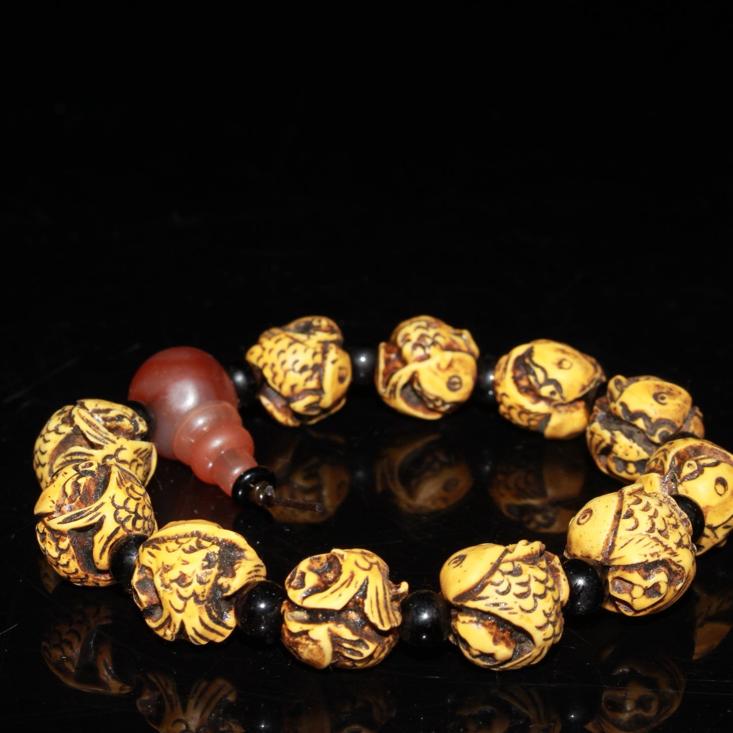 Early collection of ox bone carvings, annual fish bracelet ornaments