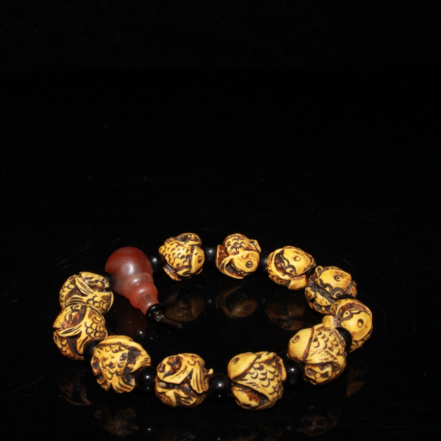 Early collection of ox bone carvings, annual fish bracelet ornaments