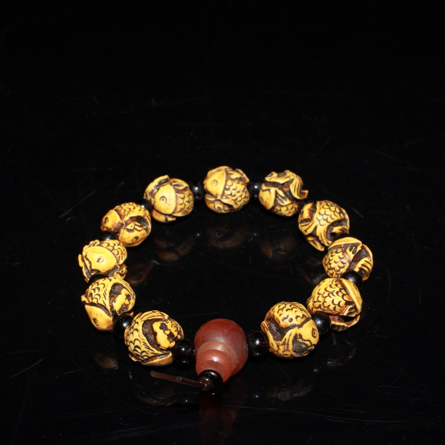 Early collection of ox bone carvings, annual fish bracelet ornaments