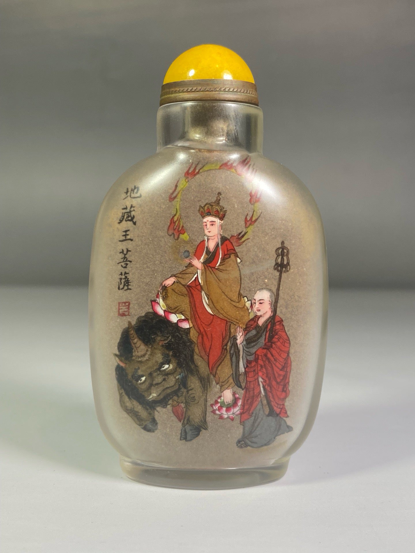 A set of Chinese antique glass inner paintings depicting the four great bodhisattvas and a snuff bottle