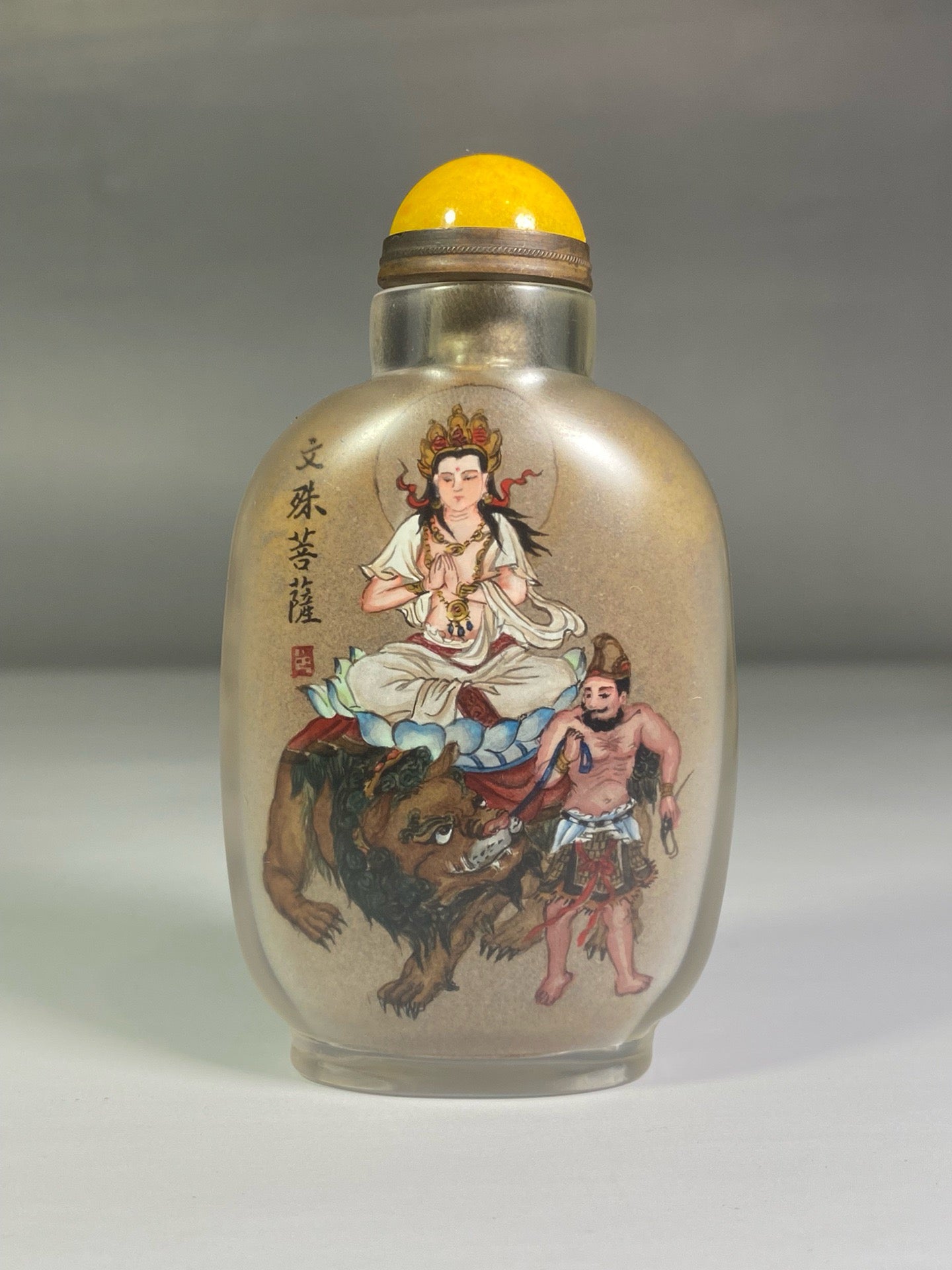 A set of Chinese antique glass inner paintings depicting the four great bodhisattvas and a snuff bottle