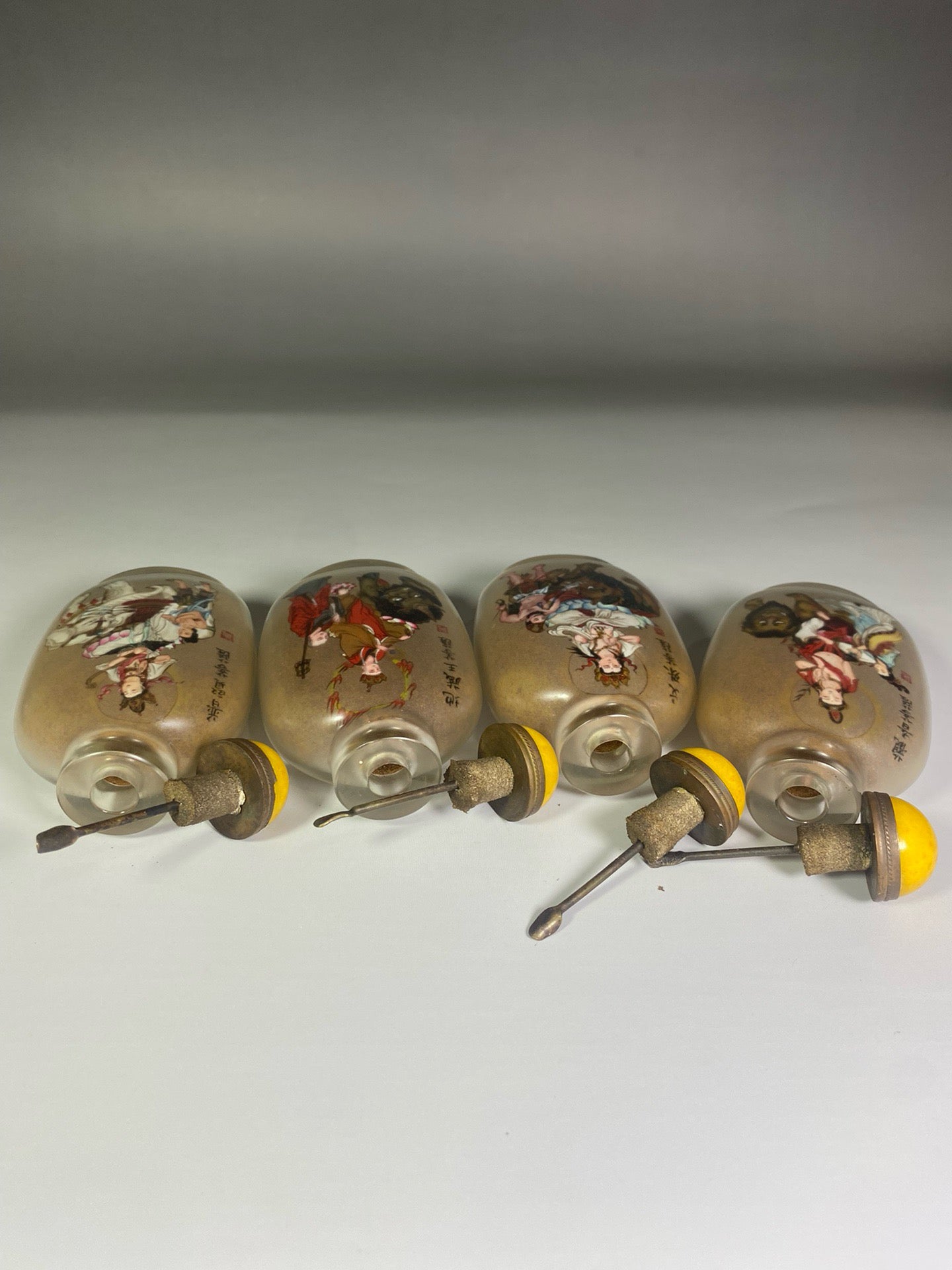 A set of Chinese antique glass inner paintings depicting the four great bodhisattvas and a snuff bottle