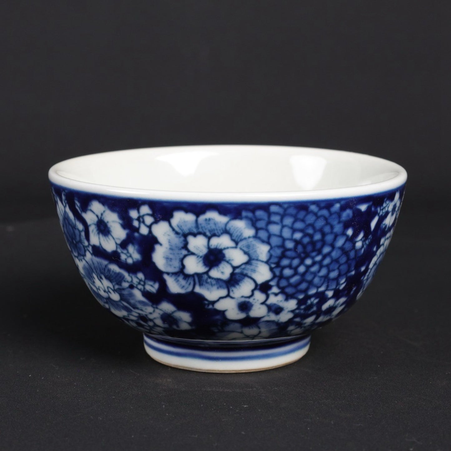 A pair of blue and white flower patterned cups