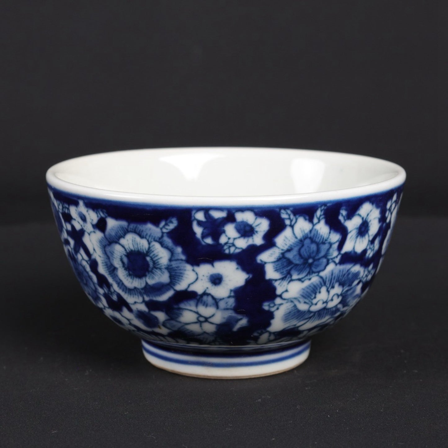 A pair of blue and white flower patterned cups