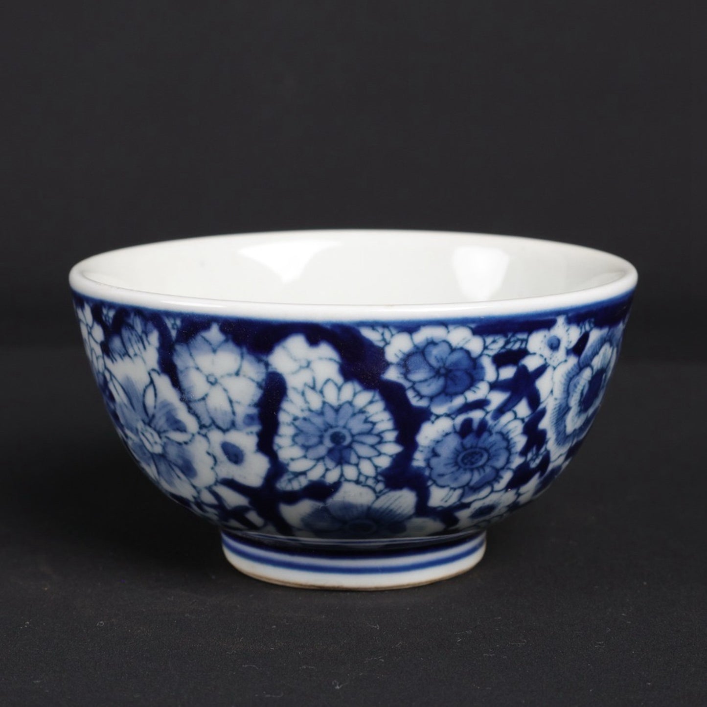 A pair of blue and white flower patterned cups