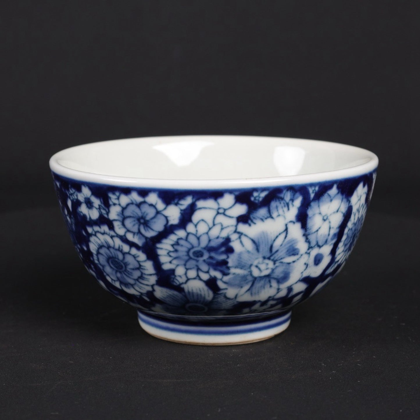 A pair of blue and white flower patterned cups