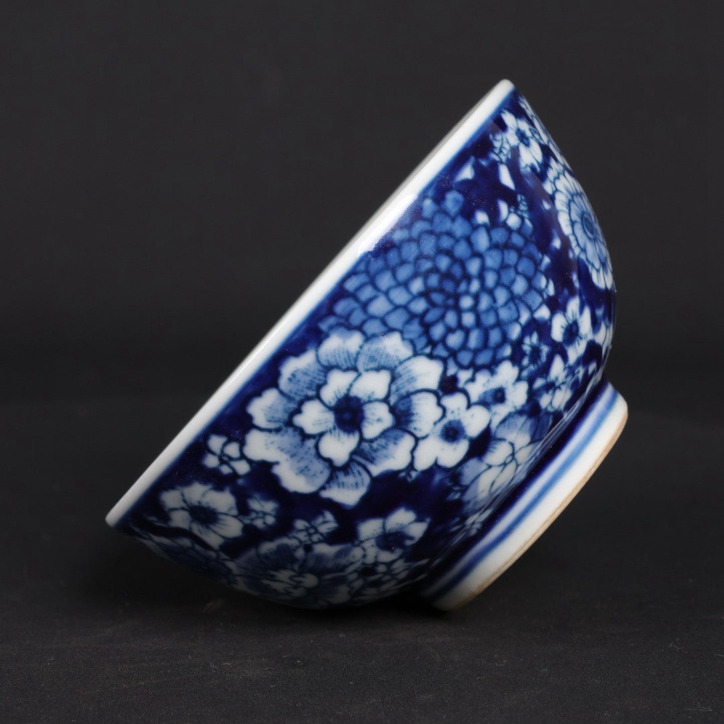 A pair of blue and white flower patterned cups