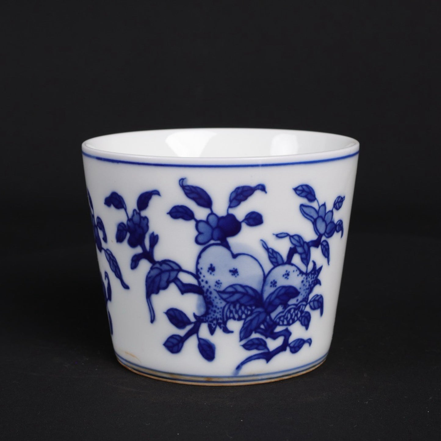 A pair of blue and white lucky, lucky, and longevity patterned cups