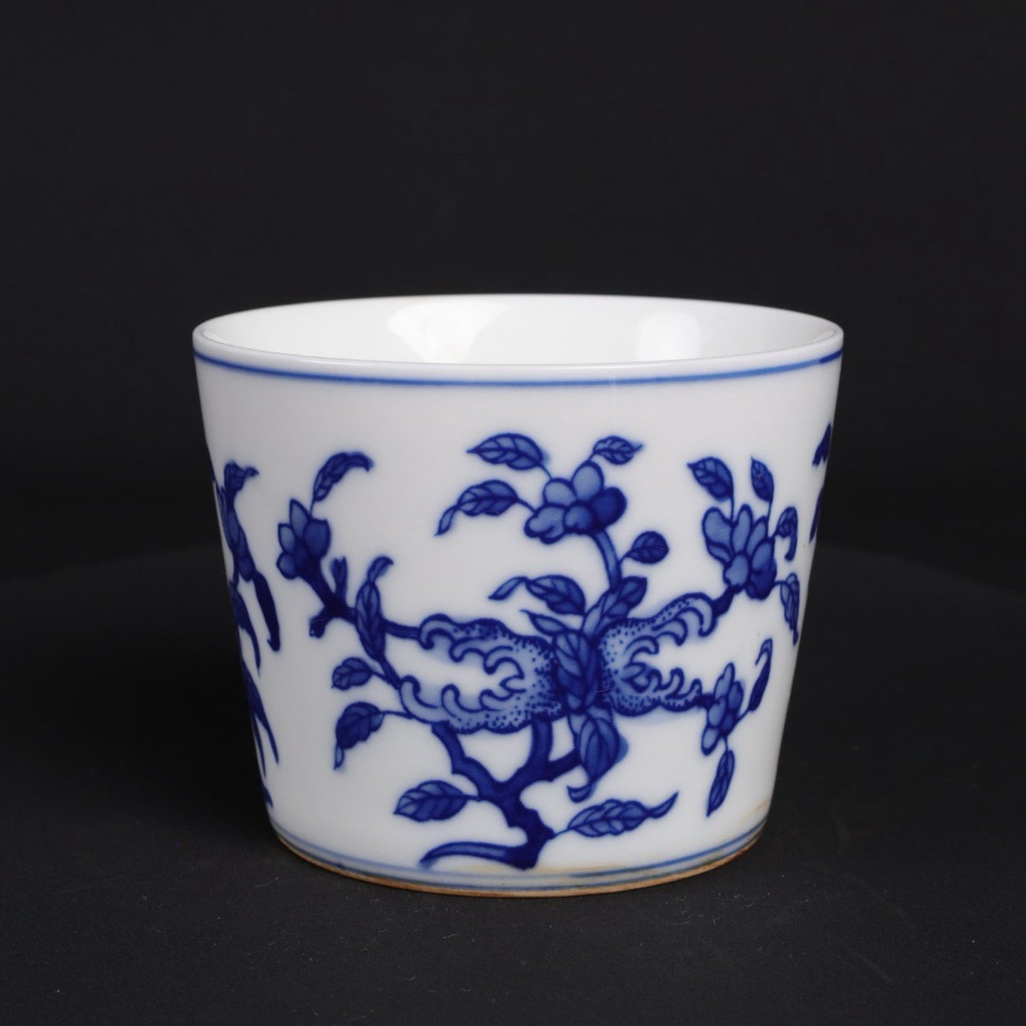 A pair of blue and white lucky, lucky, and longevity patterned cups