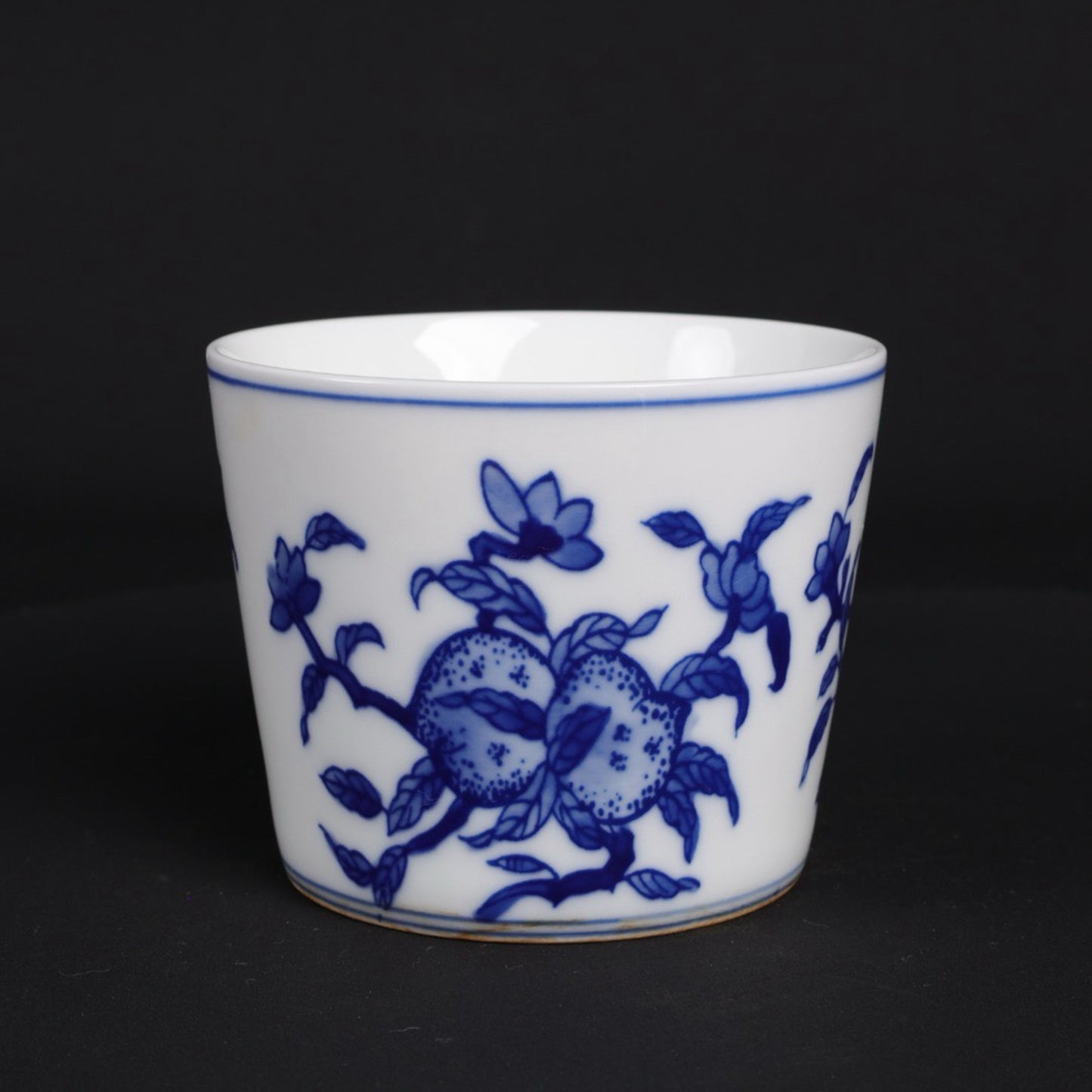 A pair of blue and white lucky, lucky, and longevity patterned cups