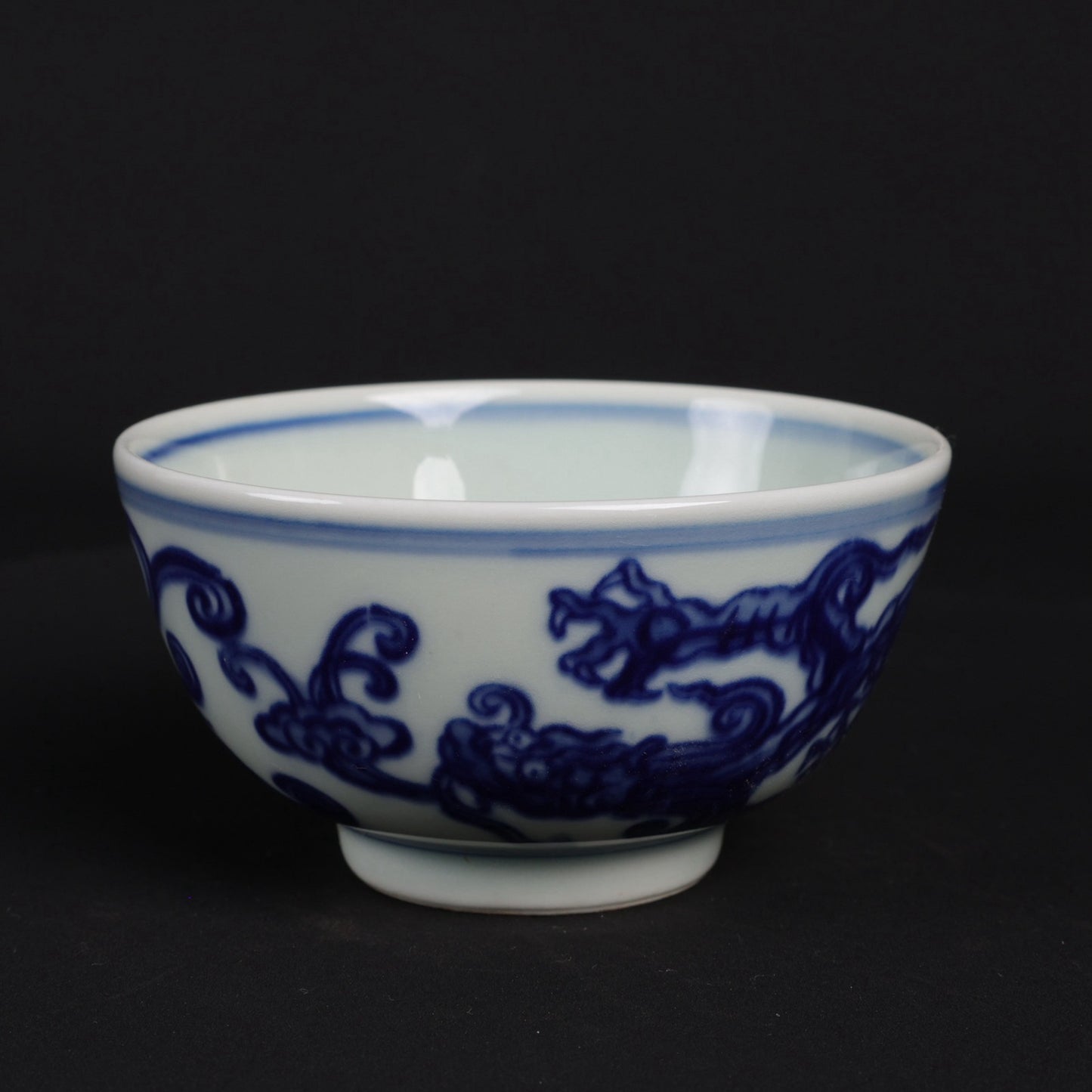 A pair of blue and white dragon patterned cups