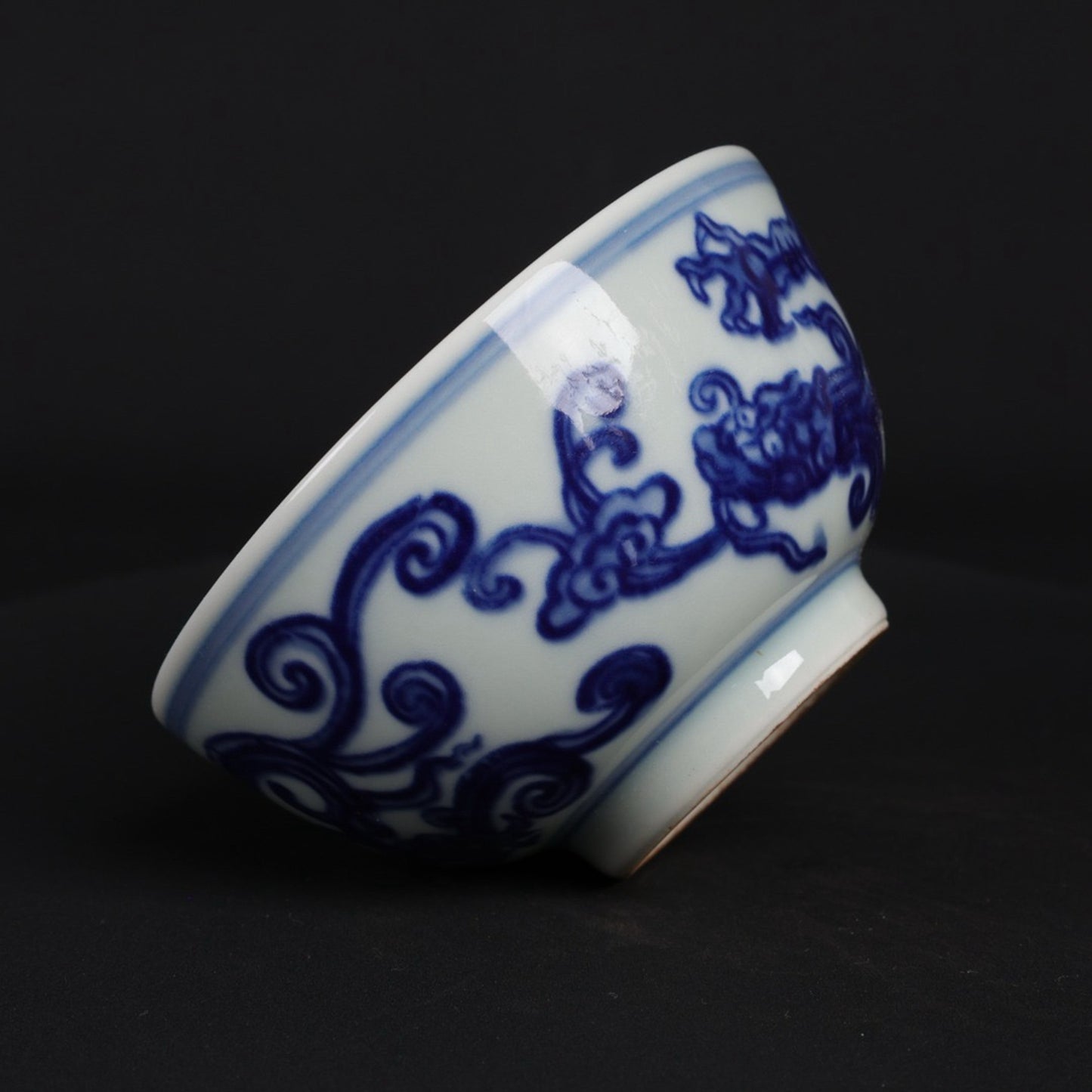 A pair of blue and white dragon patterned cups