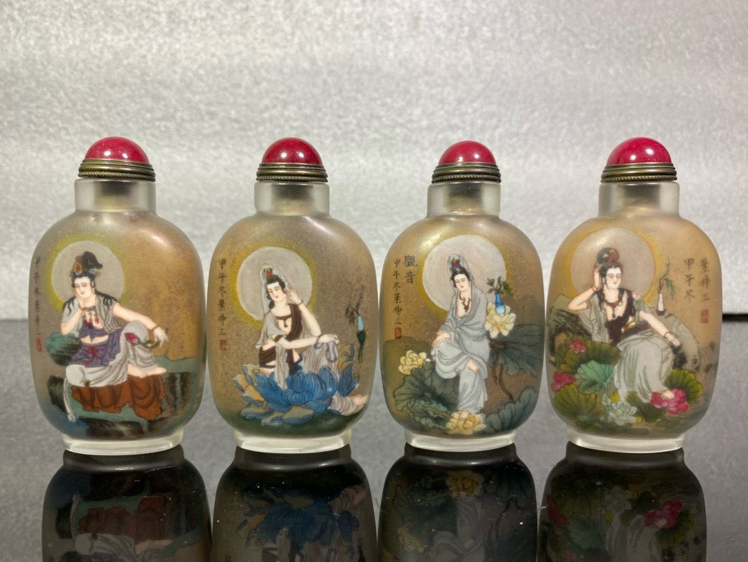 A set of Chinese antique Guanyin snuff bottles with glazed inner paintings