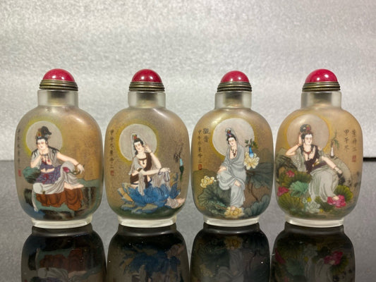 A set of Chinese antique Guanyin snuff bottles with glazed inner paintings