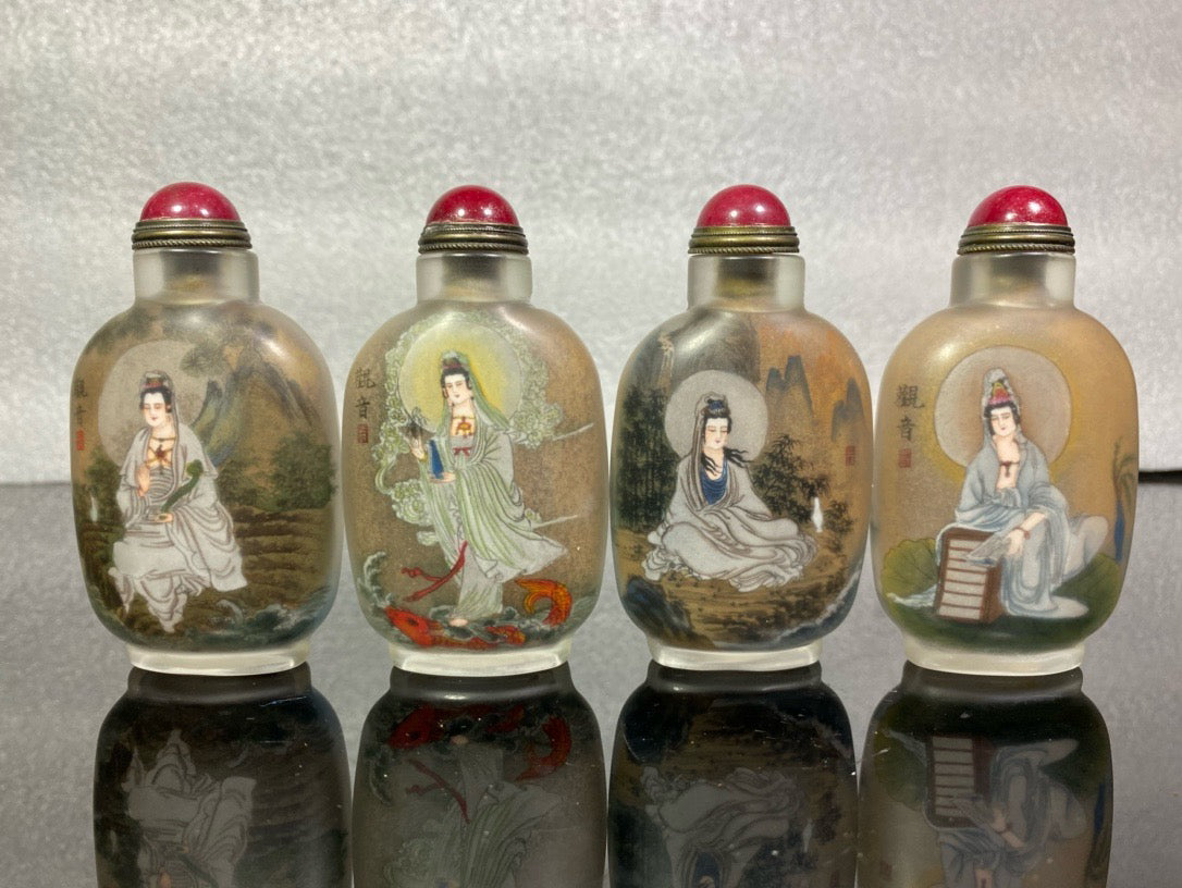 A set of Chinese antique Guanyin snuff bottles with glazed inner paintings