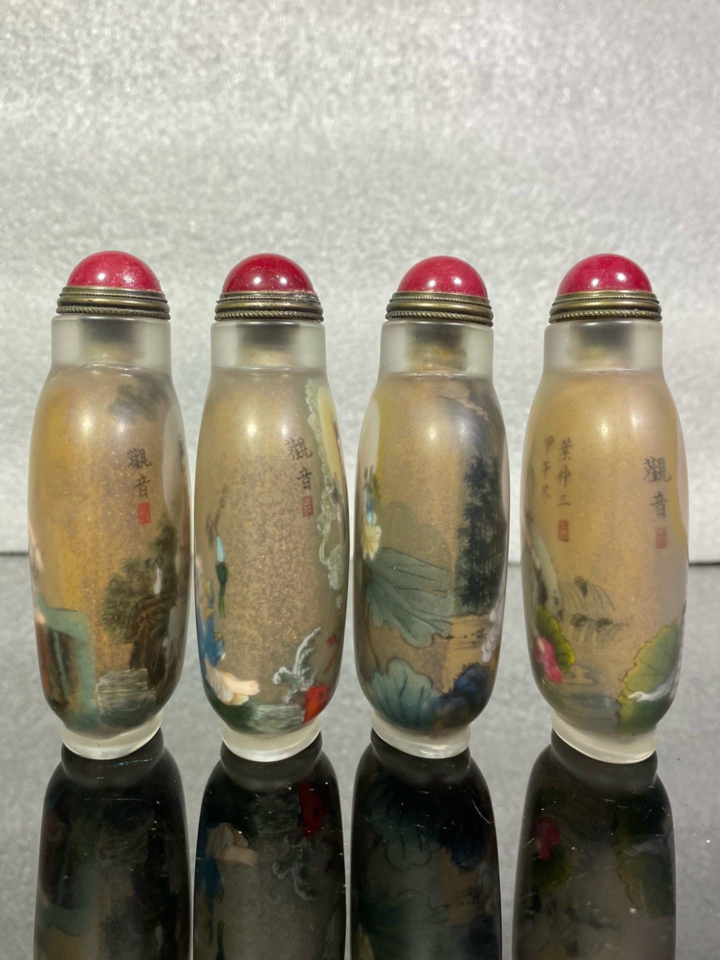 A set of Chinese antique Guanyin snuff bottles with glazed inner paintings