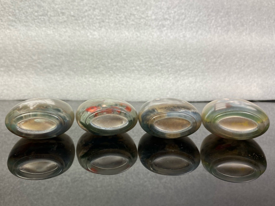 A set of Chinese antique Guanyin snuff bottles with glazed inner paintings