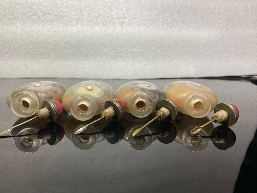 A set of Chinese antique Guanyin snuff bottles with glazed inner paintings