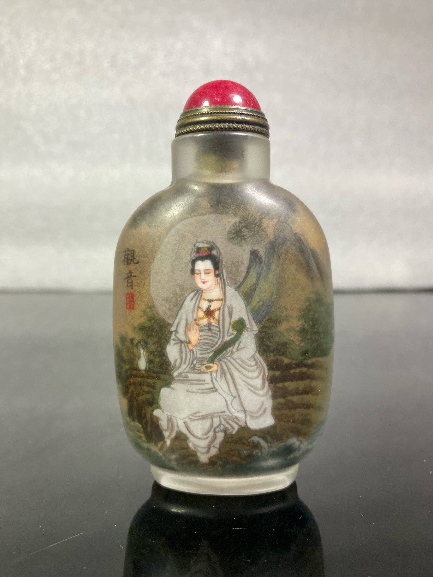 A set of Chinese antique Guanyin snuff bottles with glazed inner paintings
