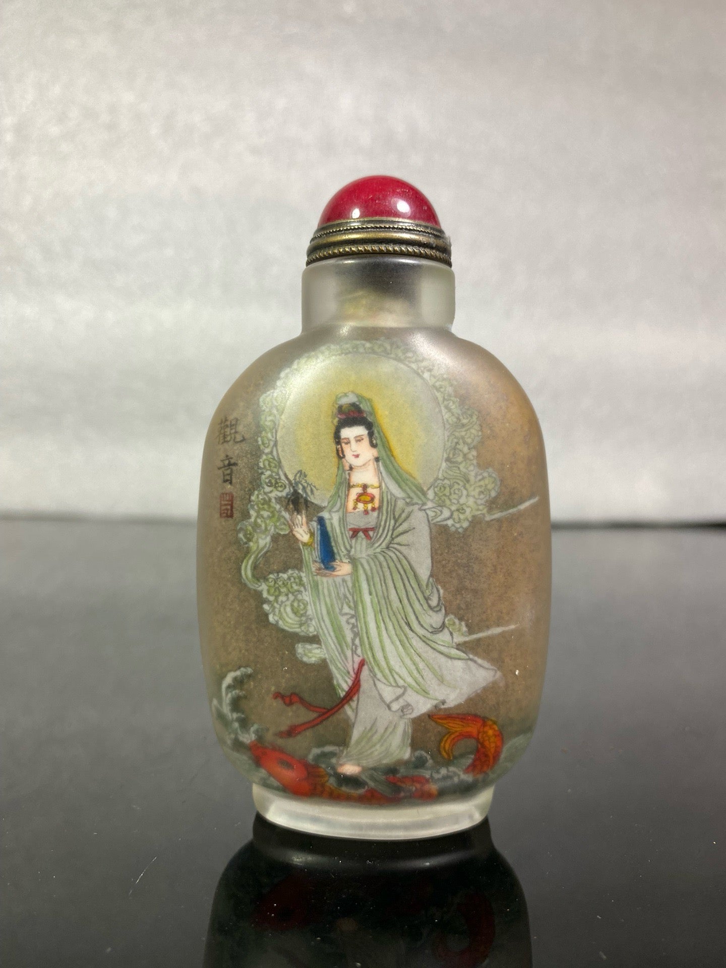 A set of Chinese antique Guanyin snuff bottles with glazed inner paintings