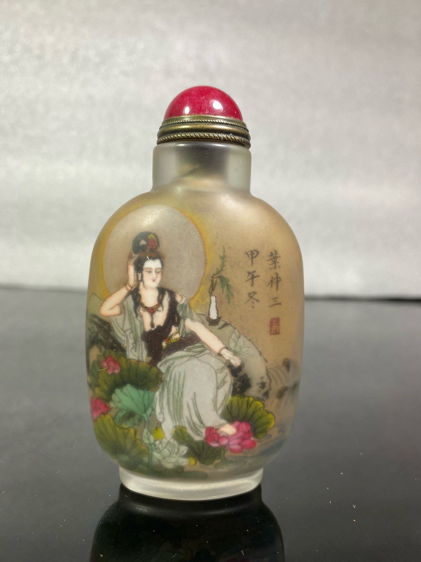 A set of Chinese antique Guanyin snuff bottles with glazed inner paintings