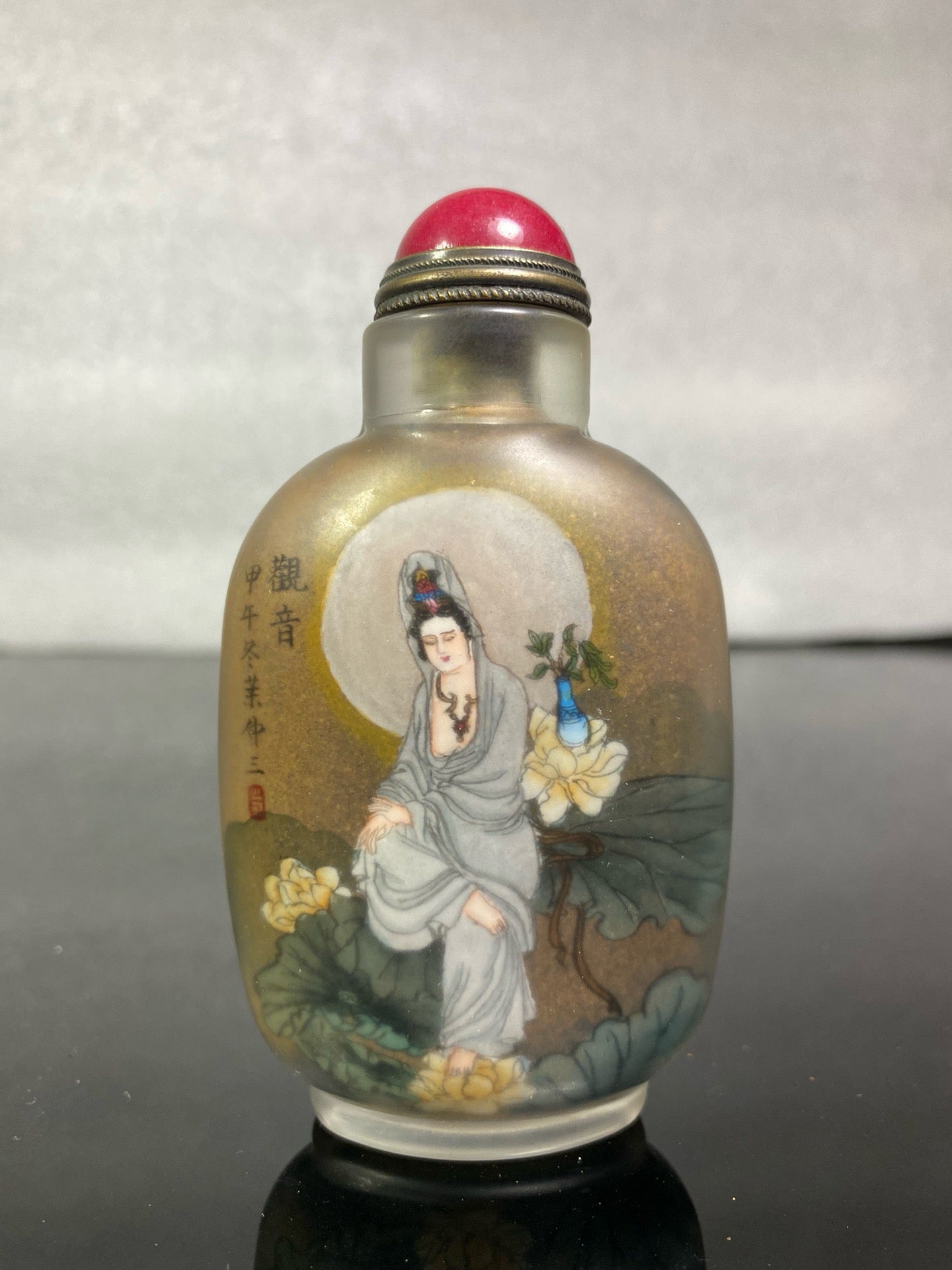 A set of Chinese antique Guanyin snuff bottles with glazed inner paintings