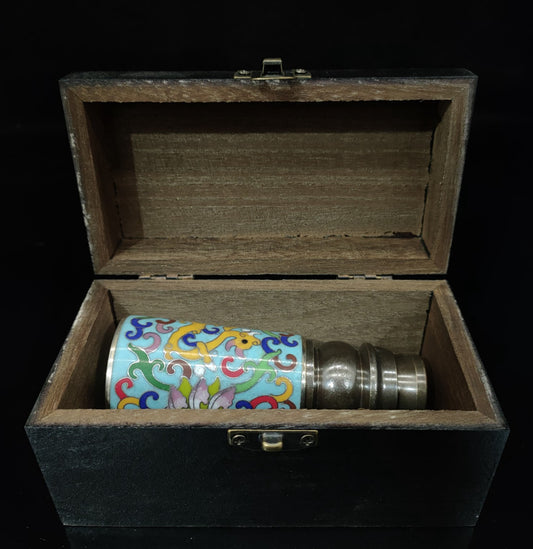 Enamel colored telescope inside wooden box
