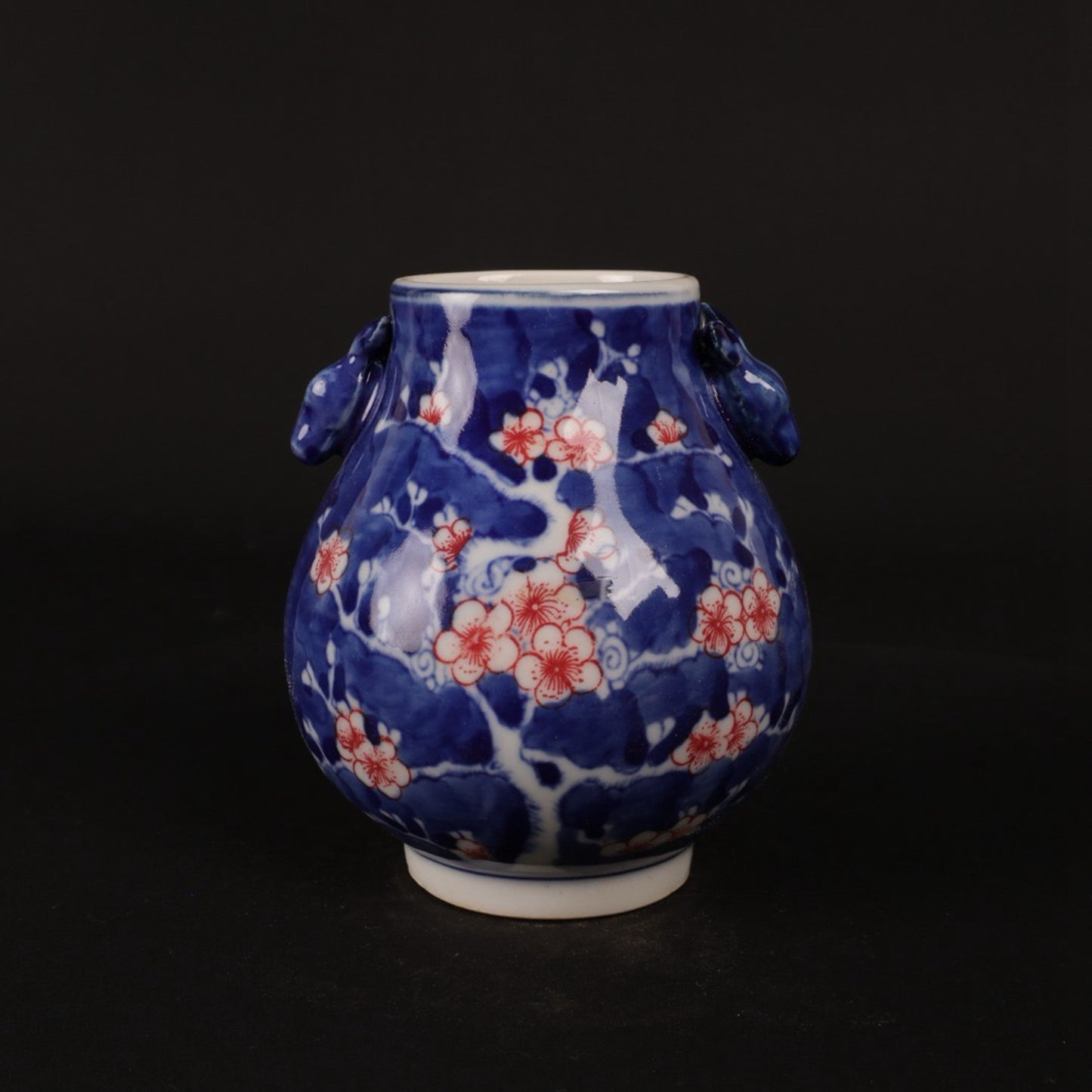 Blue and white glazed red ice plum patterned deer head statue