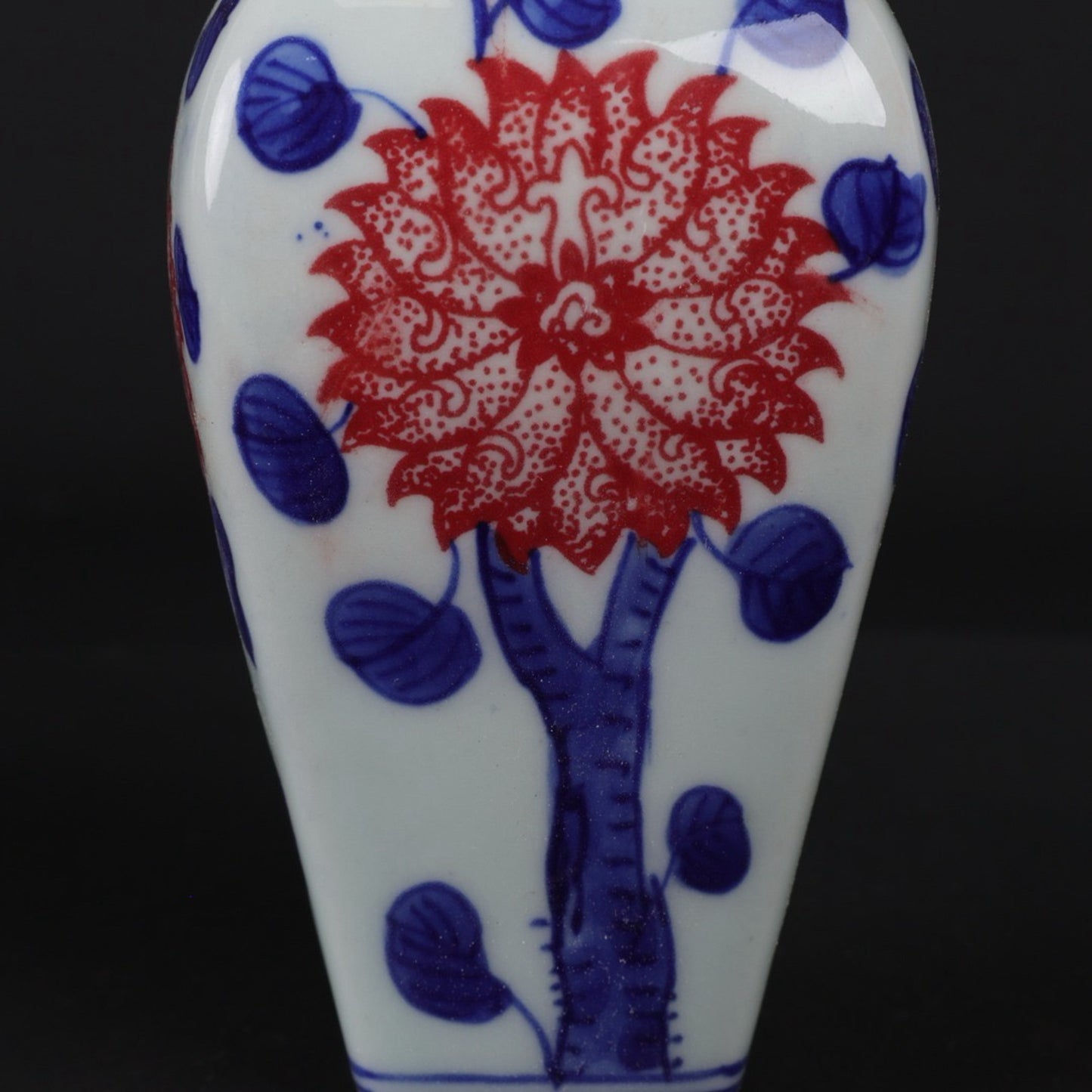 Blue and white glazed small vase with red floral patterns