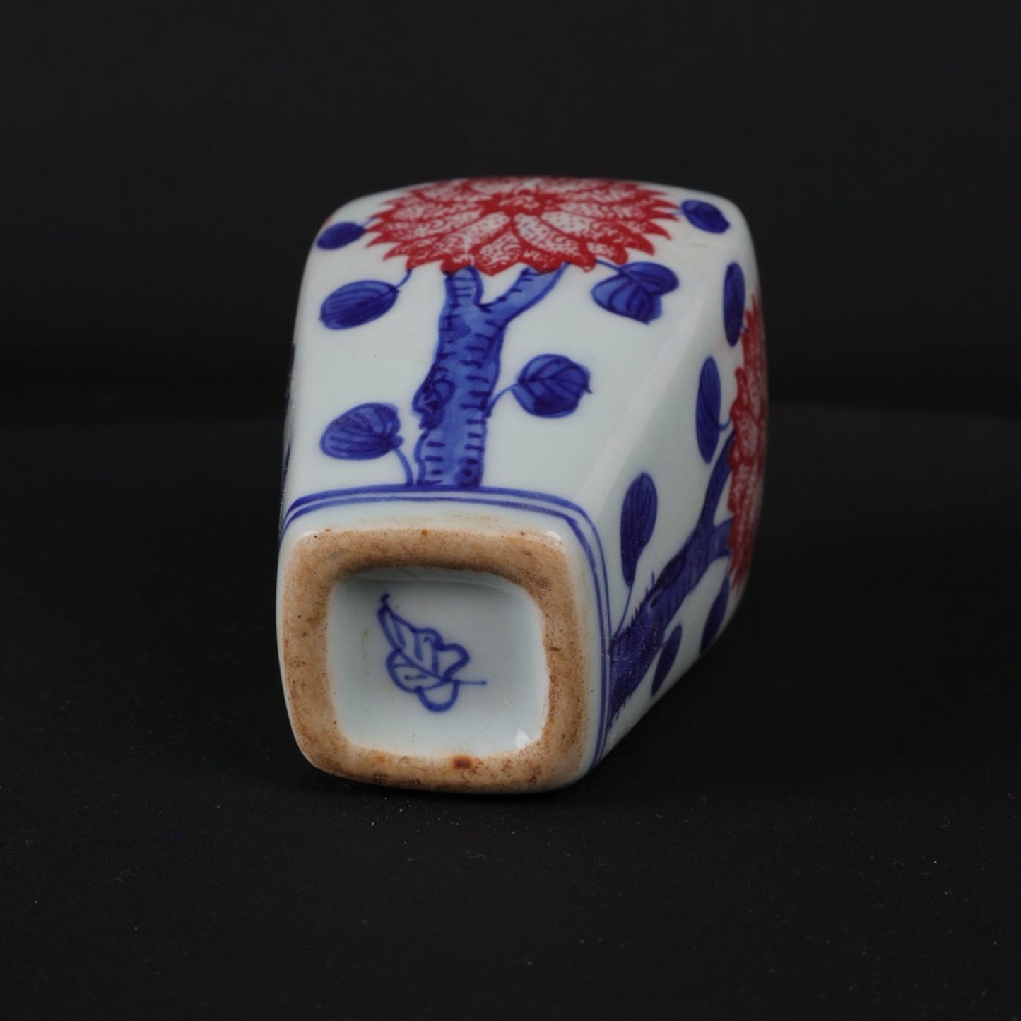 Blue and white glazed small vase with red floral patterns