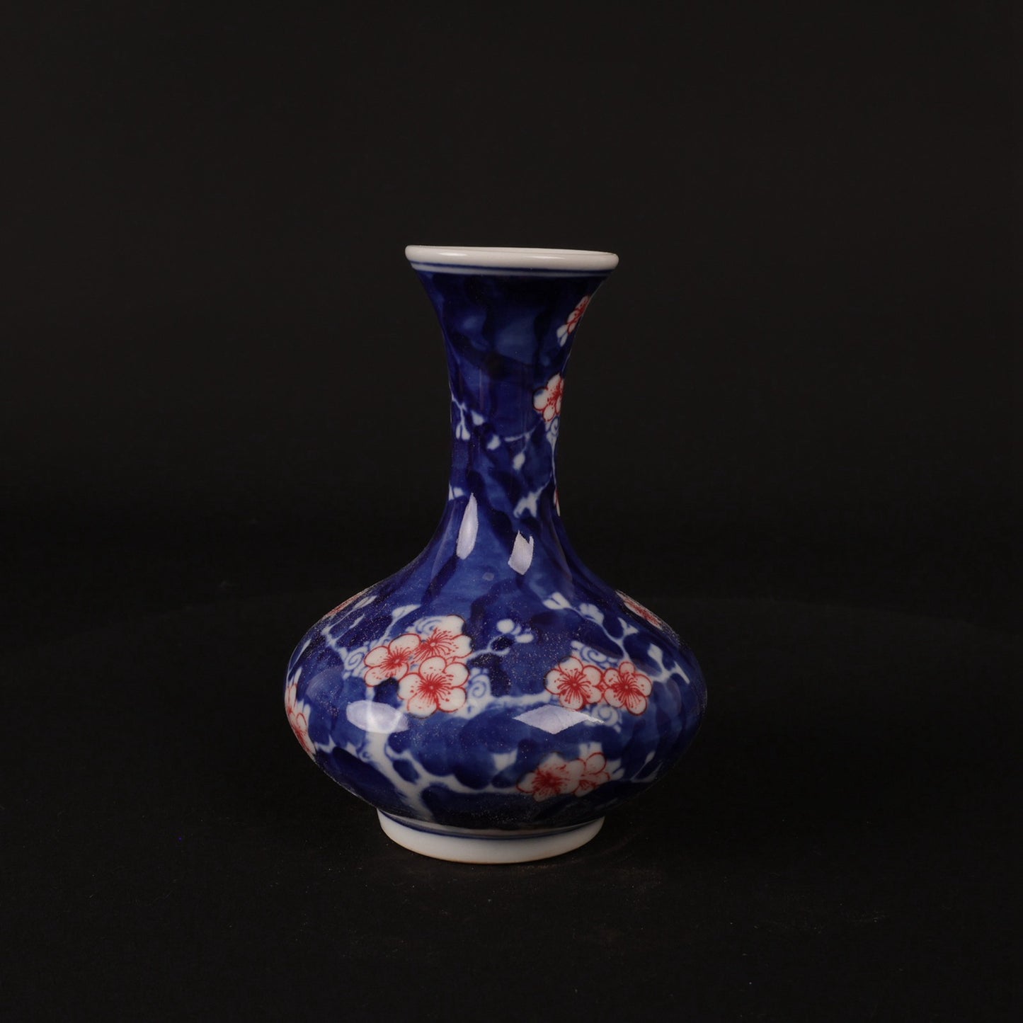 Blue and white glazed red ice plum patterned small flat belly bottle
