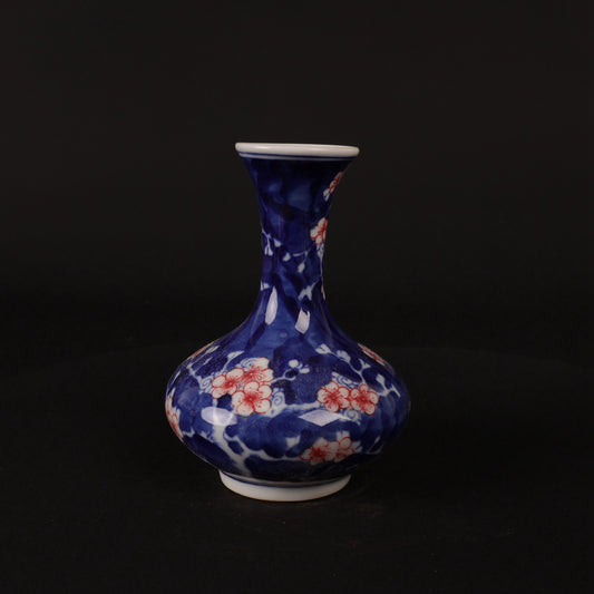 Blue and white glazed red ice plum patterned small flat belly bottle