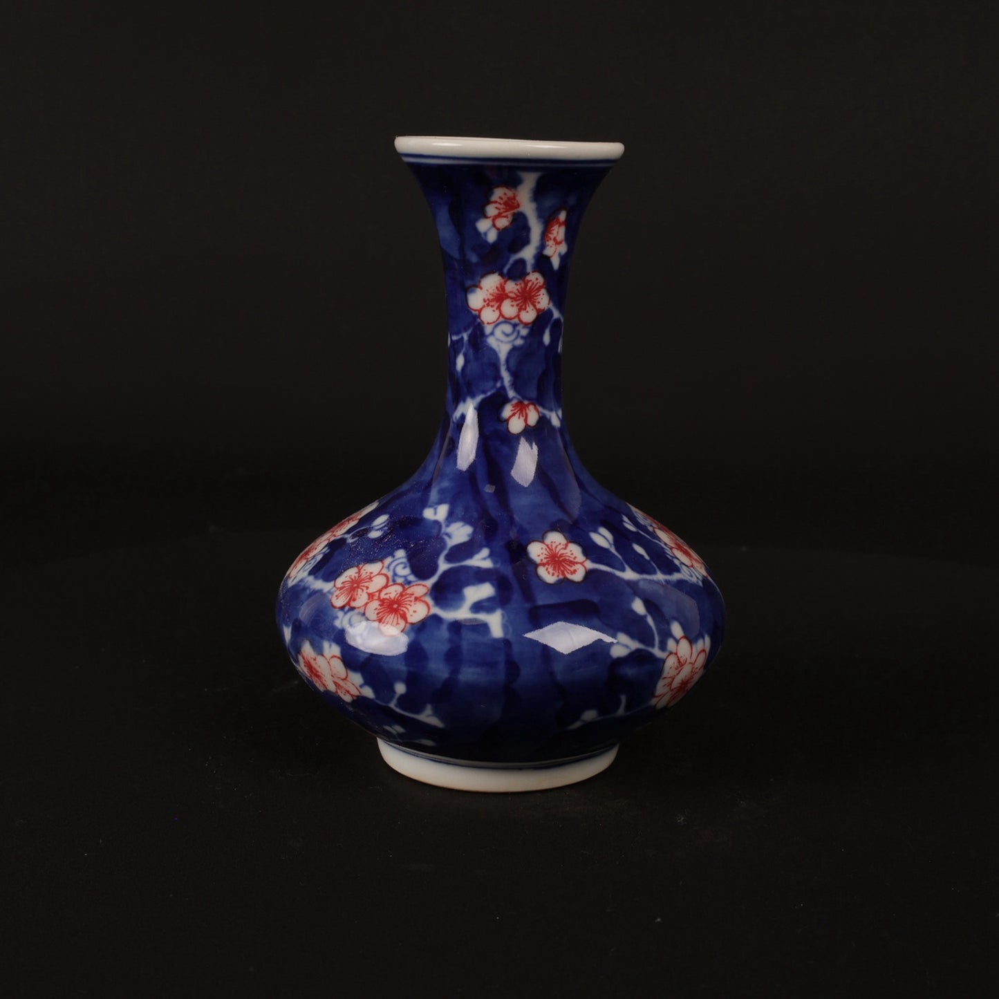 Blue and white glazed red ice plum patterned small flat belly bottle