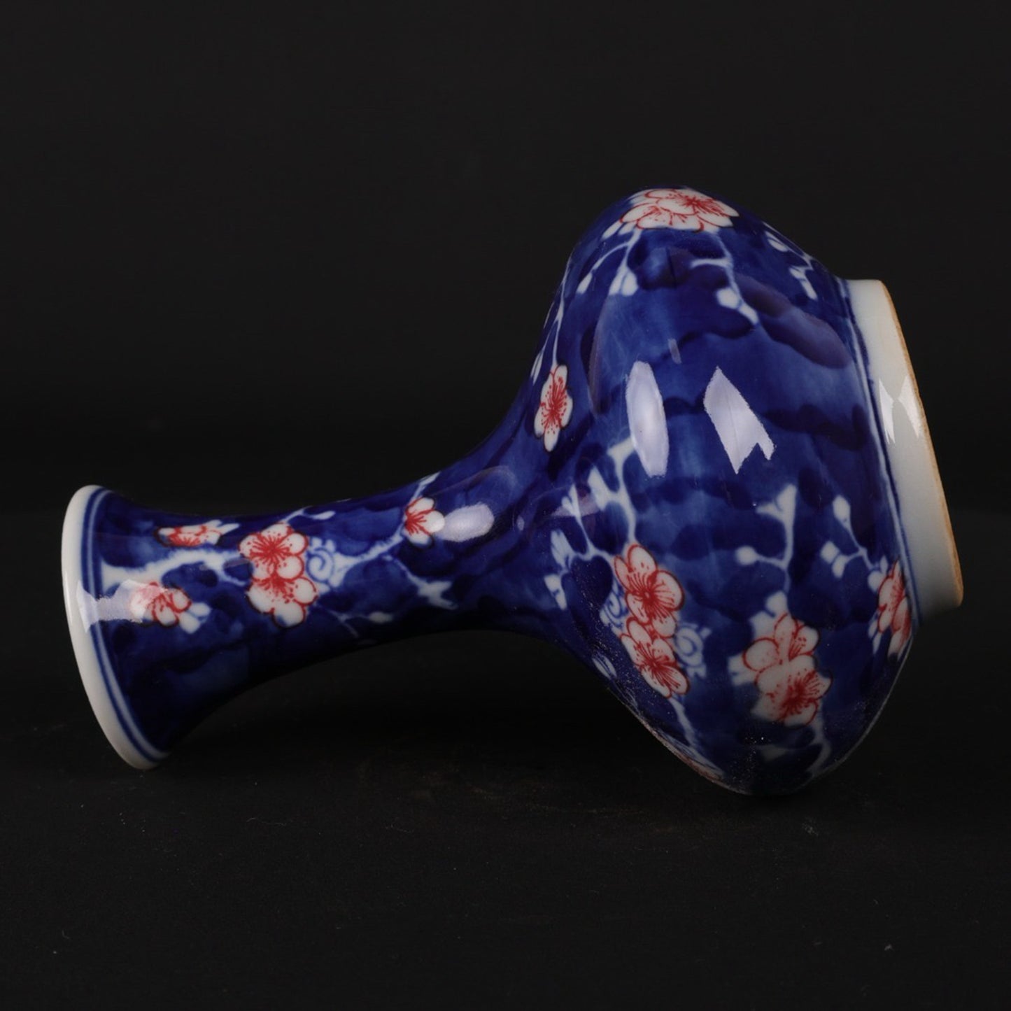 Blue and white glazed red ice plum patterned small flat belly bottle