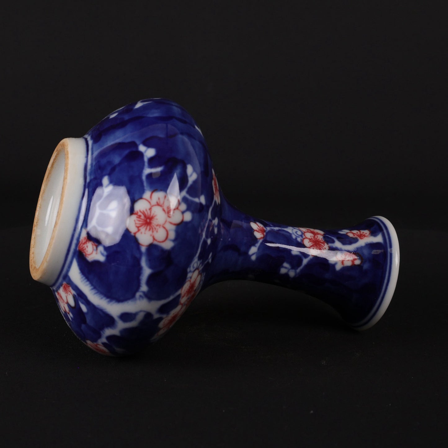 Blue and white glazed red ice plum patterned small flat belly bottle